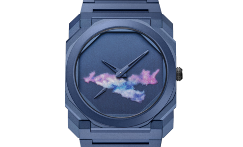 A minimalist yet distinctive blue watch with colorful cloud details from BVLGARI, available at Hing Wa Lee Jewelers.