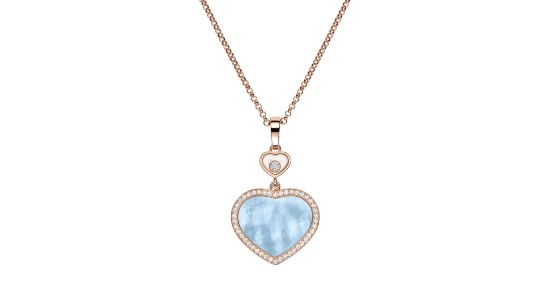A rose gold Chopard necklace with a turquoise heart pendant, available at Hing Wa Lee Jewelers.