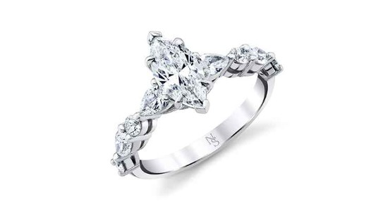 A white gold engagement ring with a marquise cut center stone, available at Hing Wa Lee Jewelers.