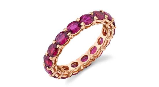 A rose gold wedding band with oval cut rubies, available at Hing Wa Lee Jewelers.