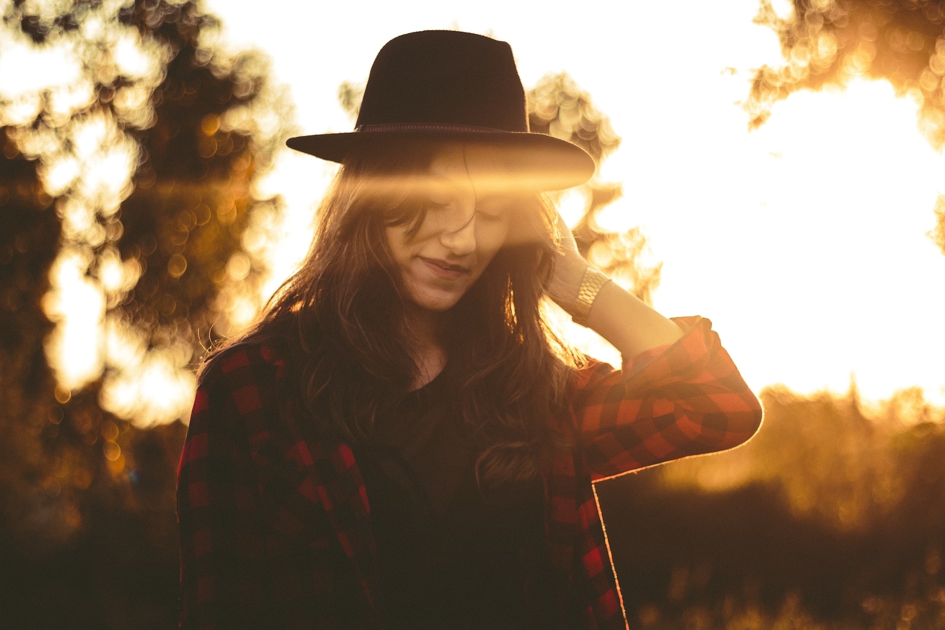 lady standing in the sunlight wearing a luxury watch