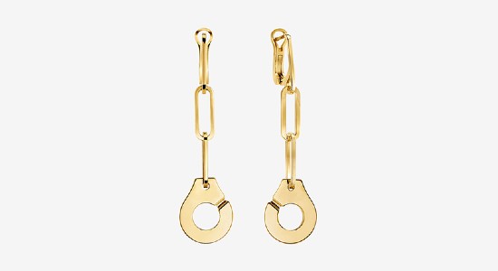 a pair of yellow gold drop earrings with a fine chain by Dihn Van