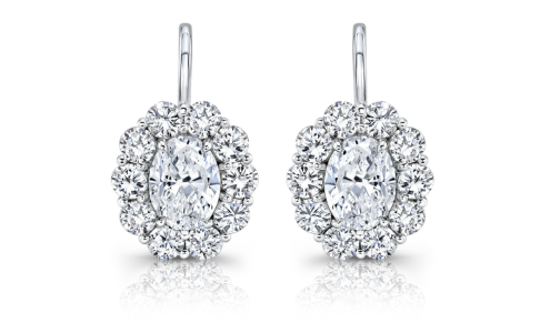 A pair of Rahaminov diamond halo earrings with oval cut center stones, available at Hing Wa Lee Jewelers.