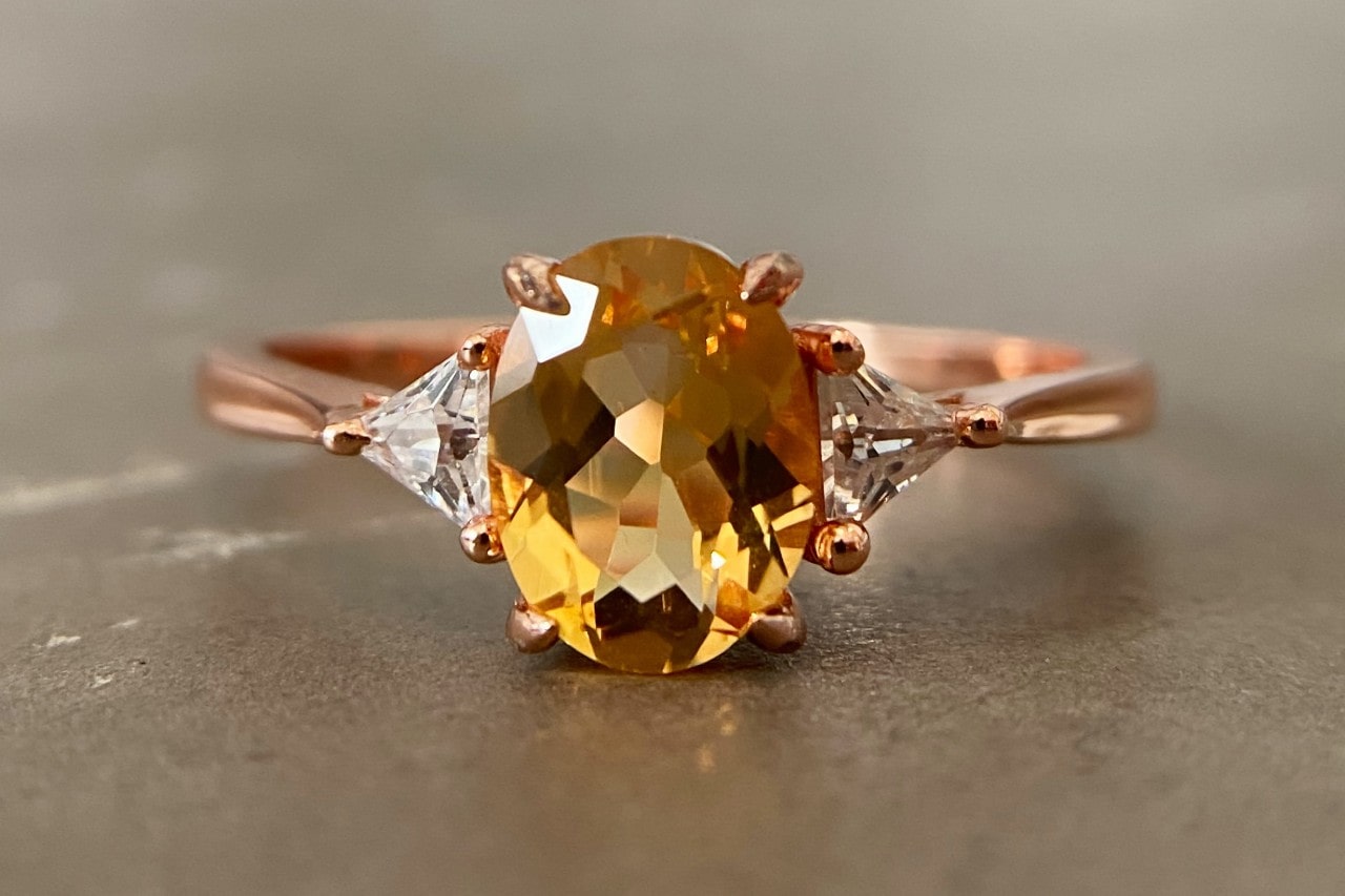 a rose gold fashion ring featuring an oval cut citrine