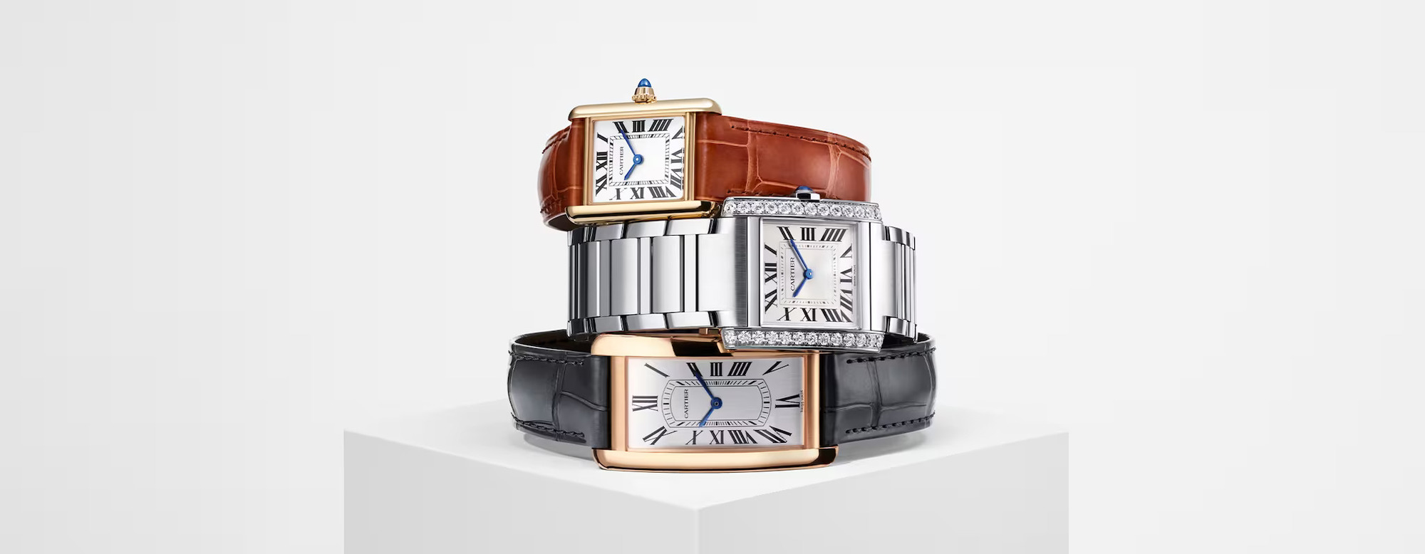 three Cartier Tank collection watches