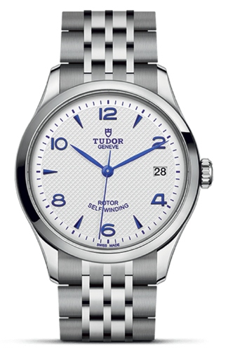 A close-up of a TUDOR 1926 watch with a white dial, blue , available at Hing Wa Lee Jewelers.