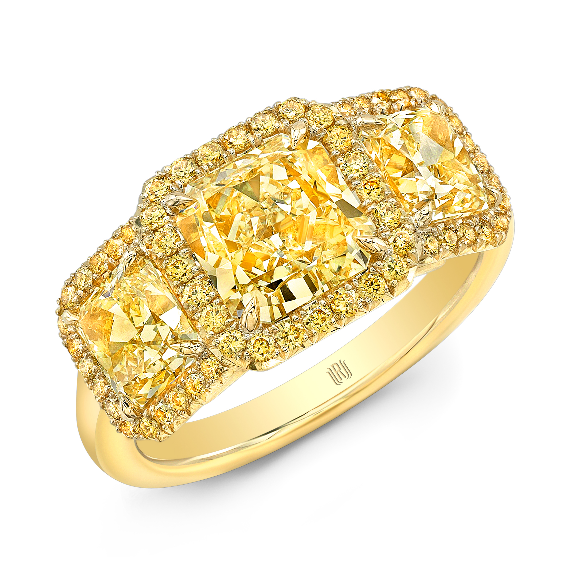 Three-stone yellow gold ring featuring radiant-cut yellow diamonds framed by smaller yellow diamond halos.