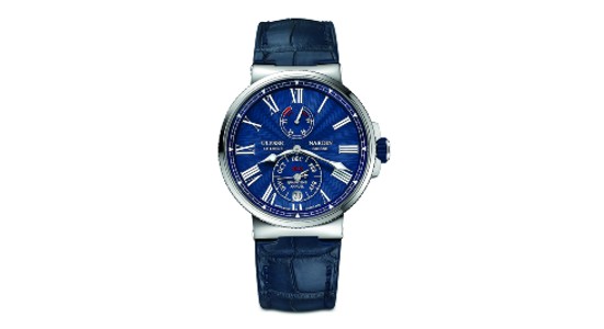 a silver watch with a blue dial and blue strap by Ulysse Nardin
