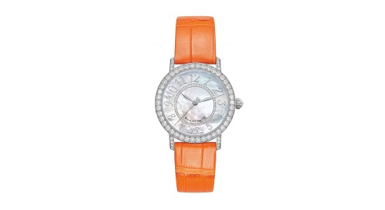 a white gold watch with a mother of pearl dial and a bright orange strap