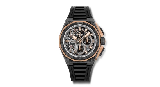 a black and gold skeleton watch by Zenith