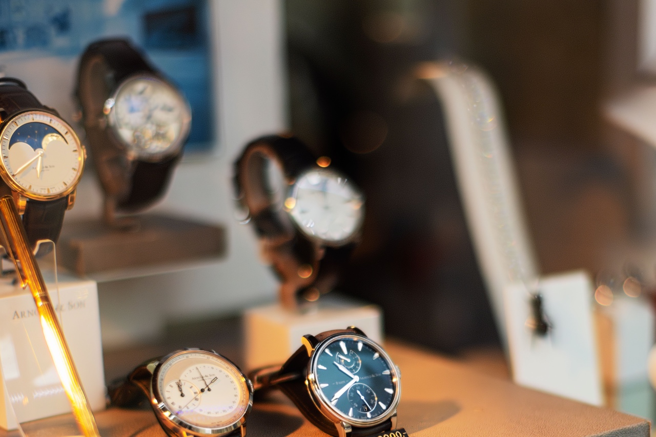 A close-up of a watch display with multiple different luxury watches.