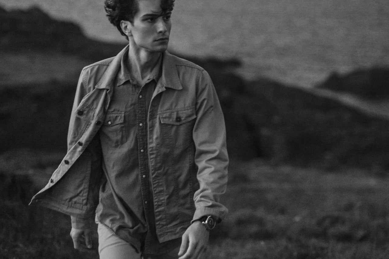 Black and white photo of a man wearing a watch Black and white photo of a man wearing a watch
