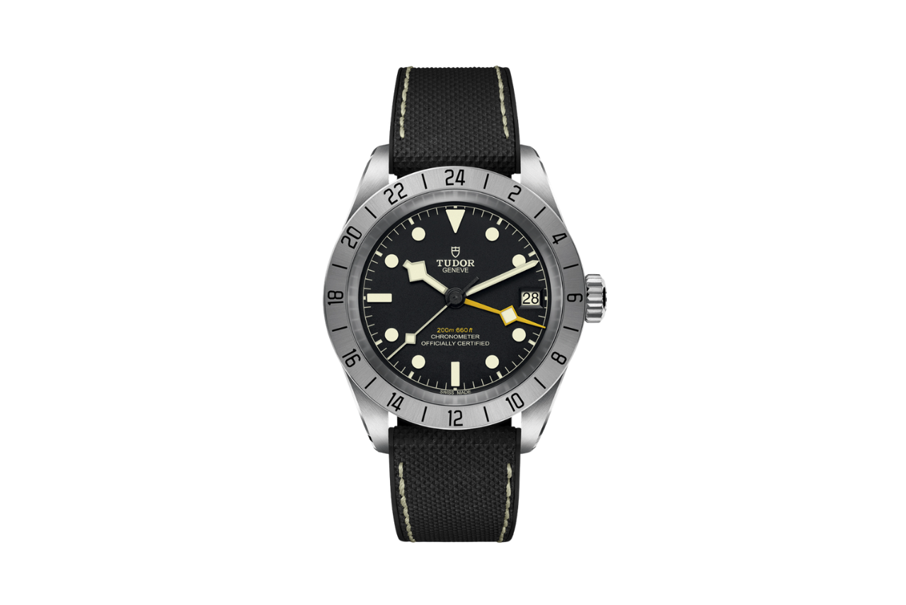 A classic watch with a black band, a silver bezel, and a black watchface. 